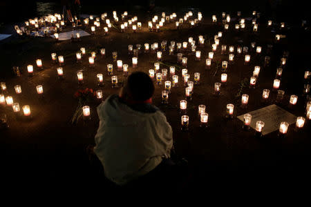 Candles are lit during a vigil for victims after a fire broke out at the Virgen de Asuncion home in San Jose Pinula on the outskirts of Guatemala City, March 8, 2017. REUTERS/Saul Martinez