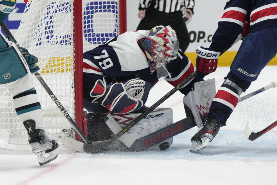 Washington Capitals goaltender Charlie Lindgren (79) makes a save against the San Jose Sharks during the second period of an NHL hockey game, Sunday, Feb. 12, 2023, in Washington. (AP Photo/Jess Rapfogel)