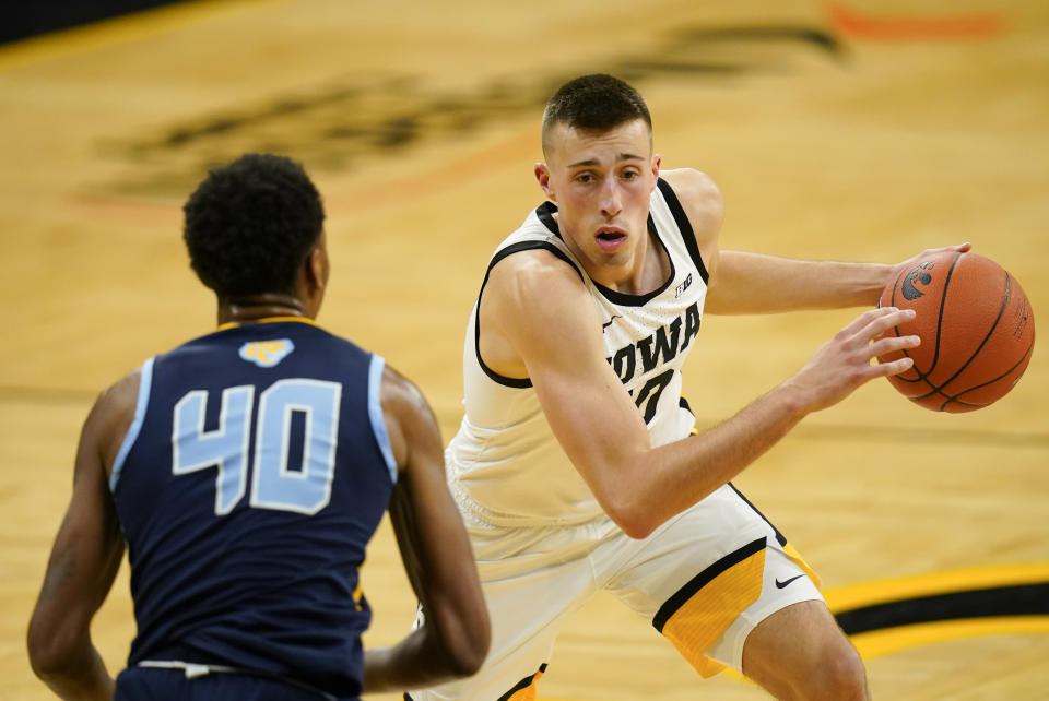 Iowa guard Joe Wieskamp drives to the basket in front of Southern University's Damiree Burns (40) during the second half of an NCAA college basketball game, Friday, Nov. 27, 2020, in Iowa City, Iowa. Iowa won 103-76. (AP Photo/Charlie Neibergall)