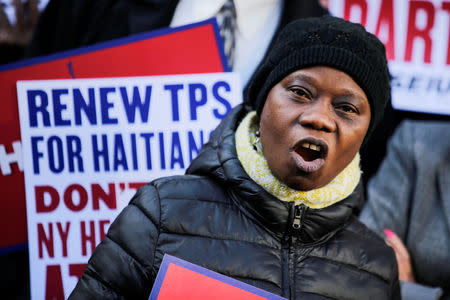 A woman speaks to media as Haitian immigrants and supporters rally to reject DHS Decision to terminate TPS for Haitians, at the Manhattan borough in New York, U.S., November 21, 2017. REUTERS/Eduardo Munoz
