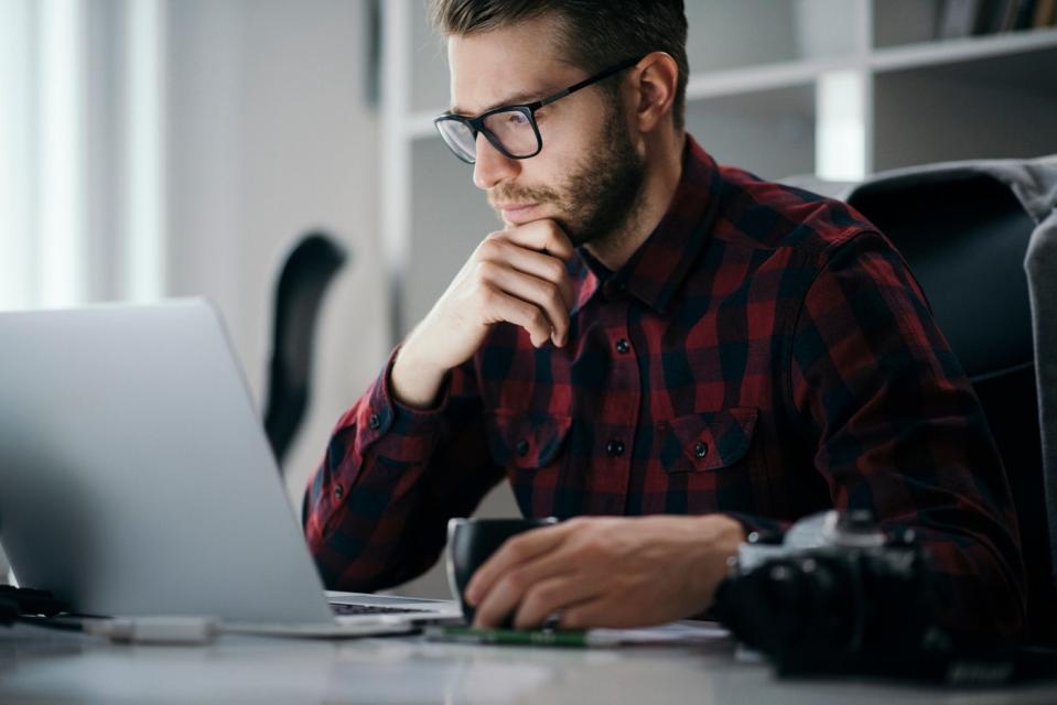 A person at a laptop.