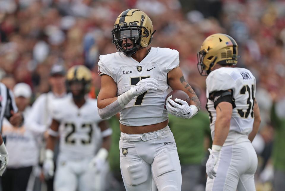 November 12, 2022;  Troy, Alabama, USA;  Army Black Knights outside linebacker Jimmy Ciarlo (7) recovers a fumble against the Troy Trojans during the first half at Veterans Memorial Stadium.  Mandatory Credit: Danny Wild-USA TODAY Sports