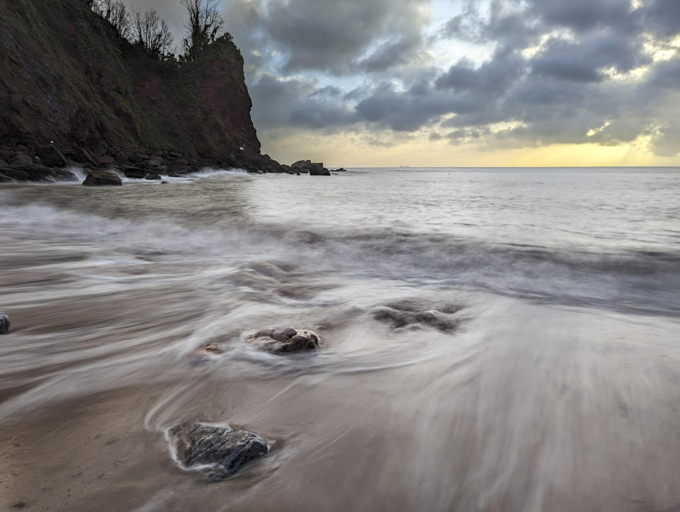 Sunrise beach with Google Pixel Long Exposure photo mode blurring the moving water