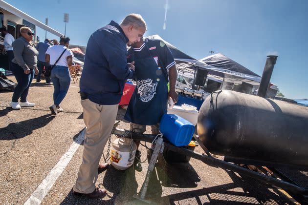 Charles Morris (right) speaks with Presley in the parking lot of the Jackson State University homecoming game on Oct. 14. Morris wanted assurances of more funding for HBCUs.