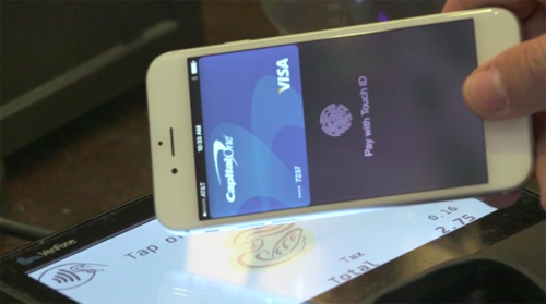 iPhone being used with Apple Pay