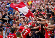 Soccer Football - Santander La Liga - Atletico Madrid vs Sevilla - Wanda Metropolitano, Madrid, Spain - September 23, 2017 Atletico Madrid's Yannick Carrasco celebrates scoring their first goal with fans REUTERS/Javier Barbancho