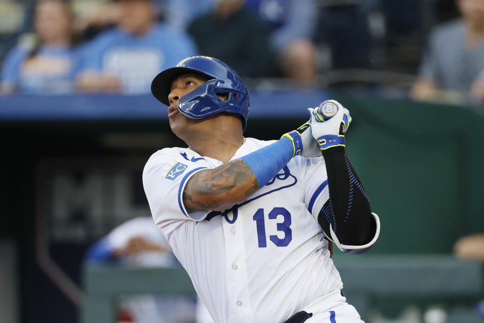 Kansas City Royals' Salvador Perez follows through on a double during the first inning of a baseball game against the Texas Rangers in Kansas City, Mo., Tuesday, April 18, 2023. (AP Photo/Colin E. Braley)