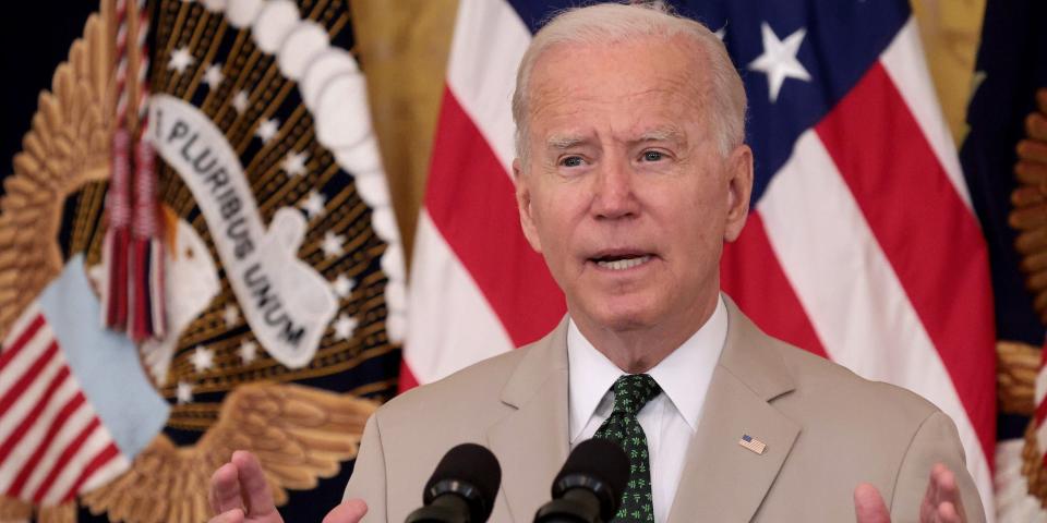 Joe Biden wearing a tan suit at the White House.