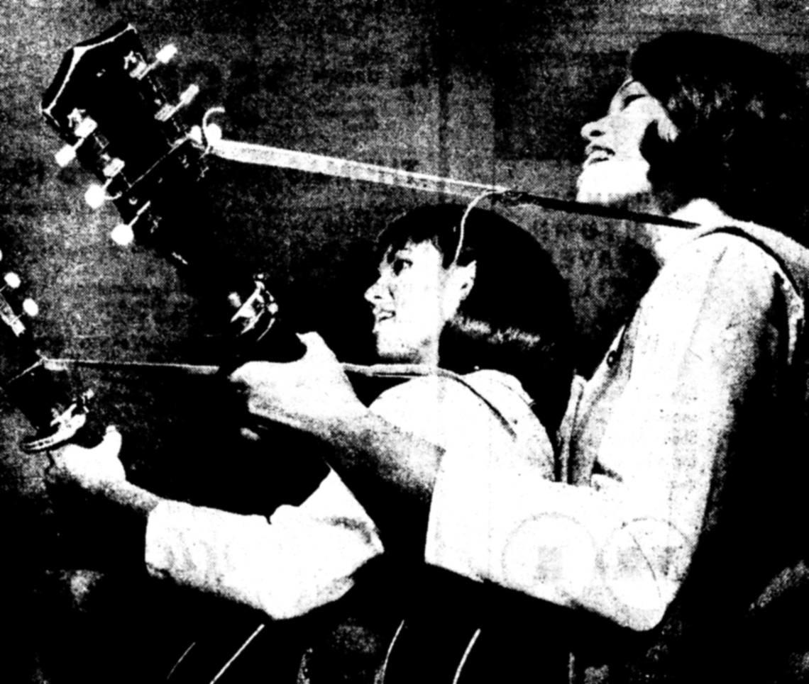 Jean and June Mulligan play their instruments in a photograph accompanying a 1964 Bee article on high school surf bands.