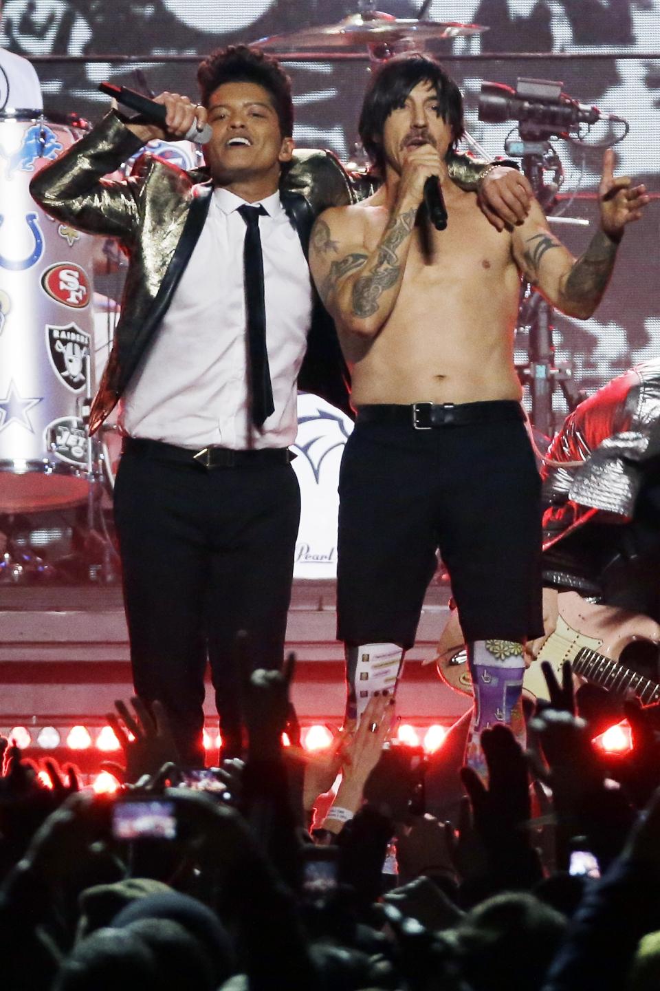 Bruno Mars, left, and Anthony Kiedis of the The Red Hot Chili Peppers perform during the halftime show of the NFL Super Bowl XLVIII football game Sunday, Feb. 2, 2014, in East Rutherford, N.J. (AP Photo/Mark Humphrey)