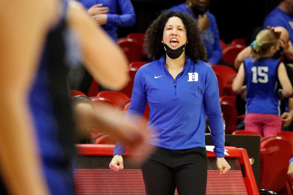 Duke Blue head coach Kara Lawson coaches from the sideline during the second half of an NCAA college basketball game against North Carolina State, Sunday, Jan. 16, 2022, in Raleigh, N.C. (AP Photo/Karl B. DeBlaker)