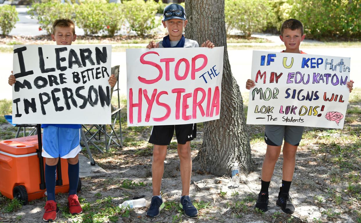 Students call for a return to in-person learning outside a Sarasota County School Board meeting in July 2020. At the time, classes were being held online because of the pandemic.
