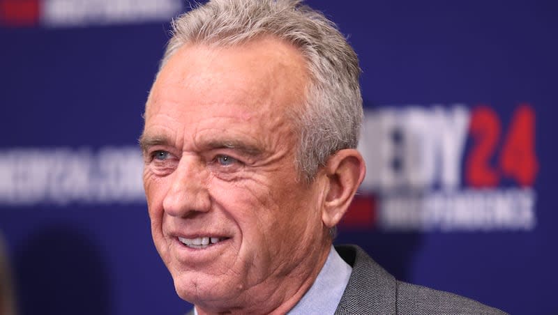 Independent presidential candidate Robert F. Kennedy Jr. smiles while speaking during a press conference at the East Senate Building at the Capitol in Salt Lake City on Wednesday, Jan. 3, 2024