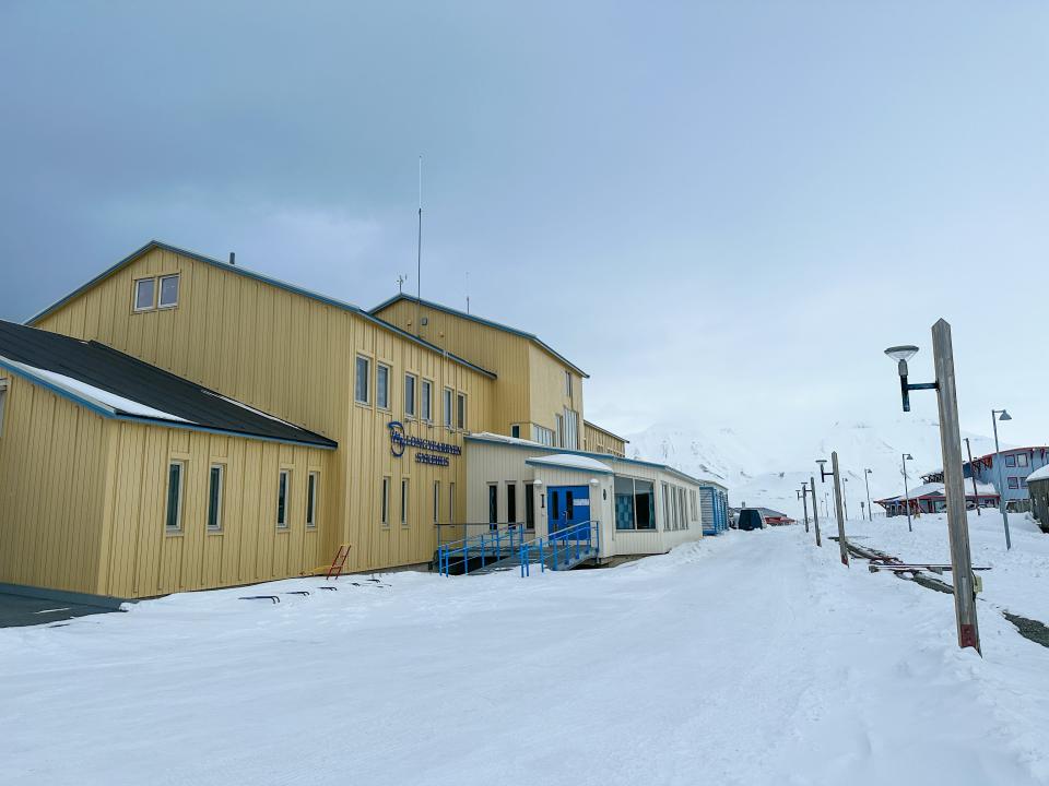 Yellow hospital surrounded by snow