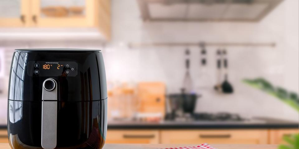 air fryer machine cooking potato fried in kitchen