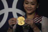 Sunisa Lee, of United States, poses for a picture after winning the gold medal in the artistic gymnastics women's all-around final at the 2020 Summer Olympics, Thursday, July 29, 2021, in Tokyo, Japan. (AP Photo/Gregory Bull)