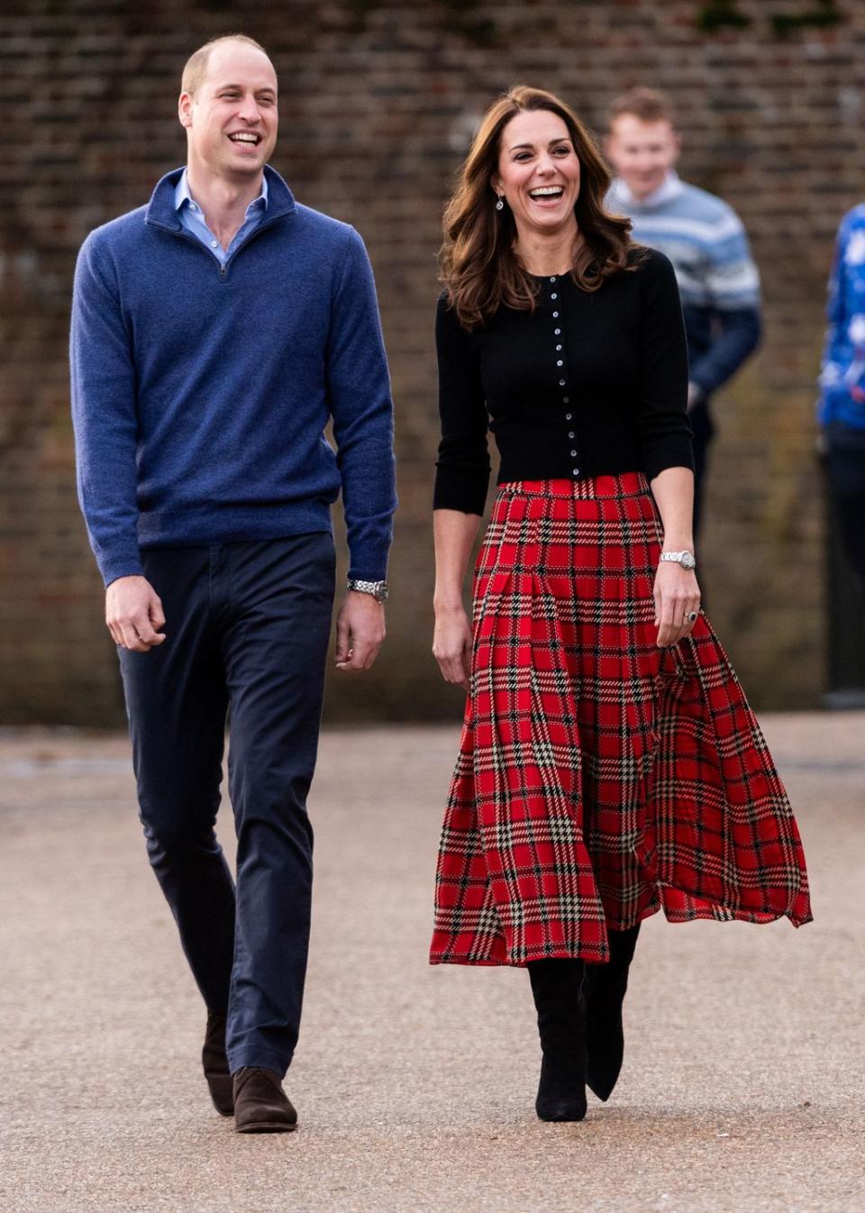 Will and Kate are all smiles as they head to a Christmas party.