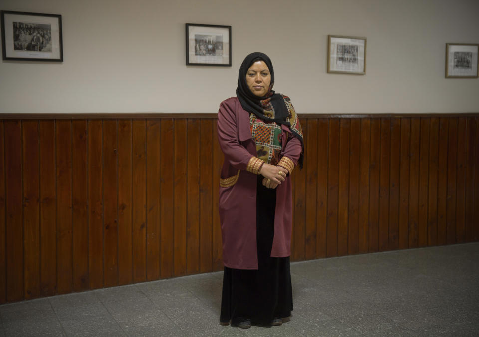 In this Wednesday, March 26, 2014 photo, Afghan lawmaker Safiq Haimoq from Badghis poses in the entrance hall of the Afghan parliament in Kabul, Afghanistan. In the last elections in 2010, 69 women won seats in Afghanistan’s 249-seat parliament. The next parliamentary vote will be held in 2015, but first are the April 5 presidential and provincial council elections. (AP Photo/Anja Niedringhaus)