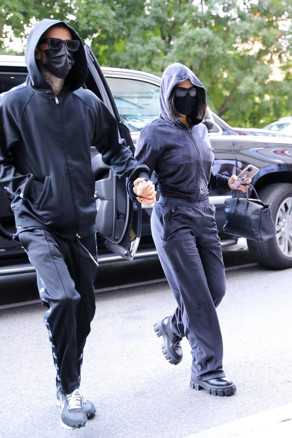 Kourtney Kardashian and Travis Barker arrive in New York City. - Credit: MEGA