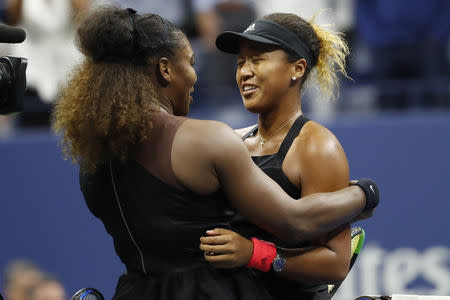 Naomi Osaka (R) hugs Serena Williams (L) after their match. Geoff Burke-USA TODAY Sports
