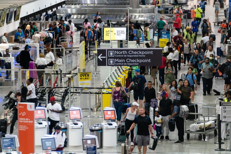 Travelers are seen ahead of the Fourth of July holiday weekend at Hartsfield-Jackson Atlanta International Airport (AFP via Getty Images)