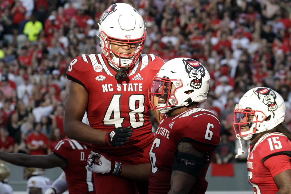 North Carolina State tight end Trent Pennix (6) celebrates his touchdown with tight end Fred Seabrough Jr. (48) during the first half of an NCAA college football game against Boston College, Saturday, Nov. 12, 2022, in Raleigh, N.C. (AP Photo/Chris Seward)