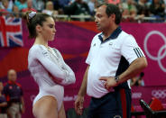 (L-R) McKayla Maroney of the United States looks on as she is consoled by coach Yin Alvarez after she fell on a dismount while competing in the Artistic Gymnastics Women's Vault Final on Day 9 of the London 2012 Olympic Games at North Greenwich Arena on August 5, 2012 in London, England. (Photo by Ronald Martinez/Getty Images)