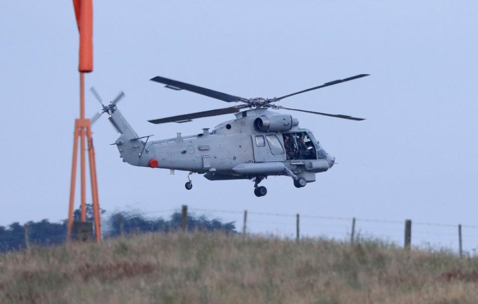 A New Zealand Navy helicopter takes off from Whakatane Airport as the mission to return victims of the White Island eruption begins. (AP)