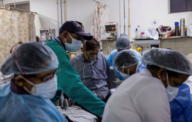 Patient suffering from the coronavirus disease (COVID-19) receives treatment inside the casualty ward at a hospital in New Delhi