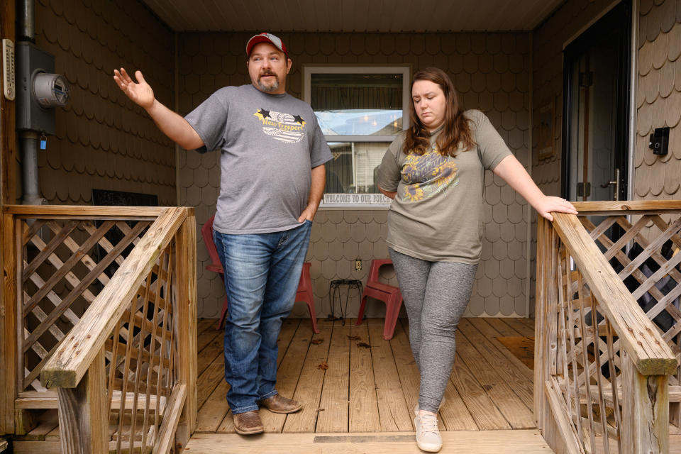  Paige and Joe Moore on the front porch of their home on March 29, 2023 in New Freeport, Pa.  (Justin Merriman for NBC News)