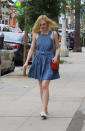 <p>Fanning nailed the denim trend in an Elle Sasson frock. She paired her easy day dress with Soludos ‘Burger and Fries’ espadrille flats and a red Gucci shoulder bag.<br></p>