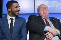 Rapper Drake (L) sits with Toronto Mayor Rob Ford during an announcement that the Toronto Raptors will host the 2016 NBA All-Star game in Toronto, September 30, 2013. Toronto was selected as the host of the National Basketball Association's (NBA) 2016 All-Star Game, marking the first time the showcase event will be held outside of the United States, the league said on Monday. REUTERS/Mark Blinch (CANADA - Tags: SPORT BASKETBALL ENTERTAINMENT POLITICS)