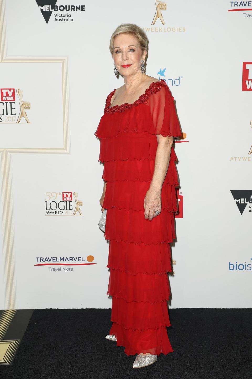 <p>Ita looked glam on the night in this red tiered gown with sparkly silver shoes.</p>