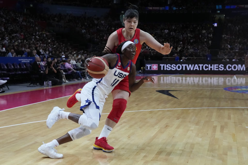 United States' Kahleah Copper runs past China's Li Yueru during their game at the women's Basketball World Cup in Sydney, Australia, Saturday, Sept. 24, 2022. (AP Photo/Mark Baker)