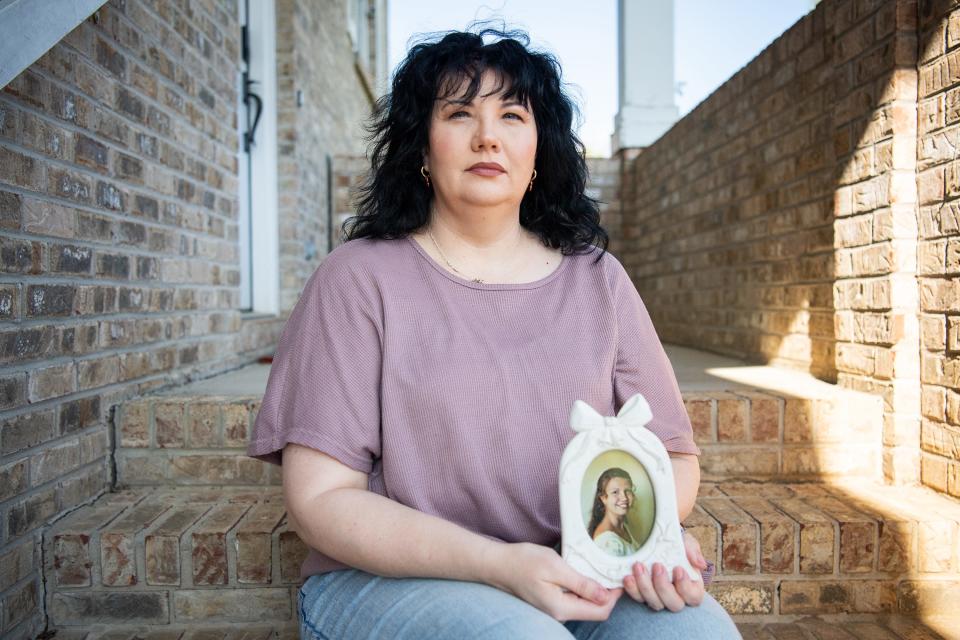 Denise Duran, holding a photo of herself as a bride in 1997, told Knox News that the leader of First Apostolic Church of Maryville, the Rev. Kenneth Carpenter, took no action when she told him her husband, a church member, was abusing her. Instead, she says, he questioned her church attendance and tithing.