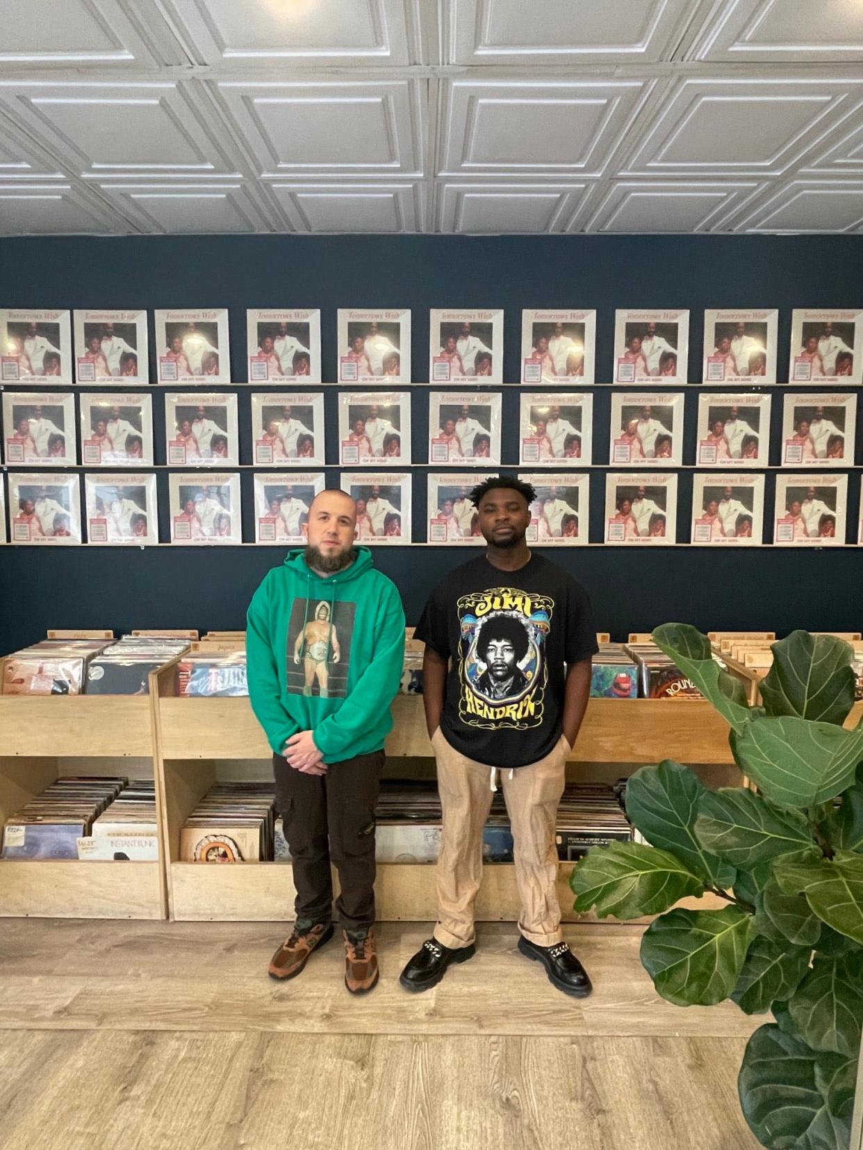 Music producers Derek "KAS" Kastal of Worcester and Marcus "Motif Alumni" Rucker of New York pose in front of copies of "On My Mind," a gospel album by Tomorrow's Wish re-released in 2023 on Kastal and Rucker's Holy Grail Records label.