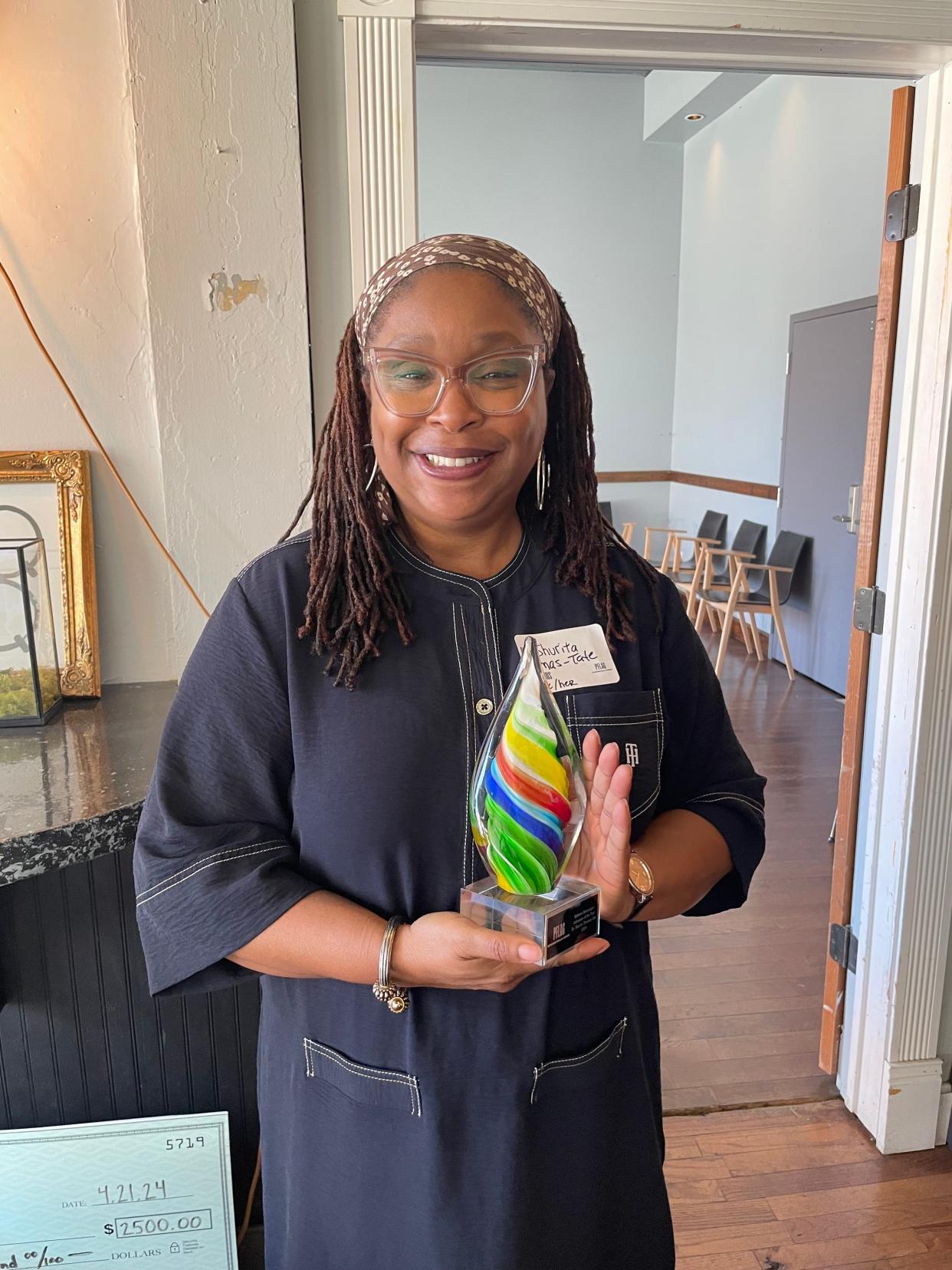 Dr. Shurita Thomas-Tate was awarded the Kathryn J. Munzinger Advocate of the Year Award by PFLAG Springfield/SWMO at a reception April 21 at Q Enoteca on Commercial Street.