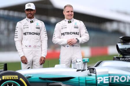 Britain Formula One - F1 - 2017 Mercedes Formula One Car Launch - Silverstone - 23/2/17 Mercedes' Lewis Hamilton and Valtteri Bottas pose during the launch. Reuters/Eddie Keogh Livepic/File Photo