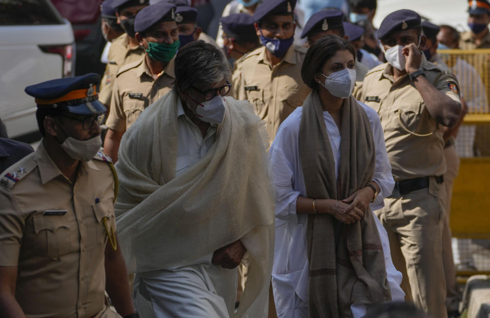 Bollywood superstar Amitabh Bachchan along with his daughter Shweta Bachchan Nanda arrives to pay tribute to Lata Mangeshkar, at her home in Mumbai, India, Sunday, Feb.6, 2022. The legendary Indian singer with a prolific, groundbreaking catalog and a voice recognized by a billion people in South Asia, died Sunday morning of multiple organ failure. She was 92. (AP Photo/Rafiq Maqbool)