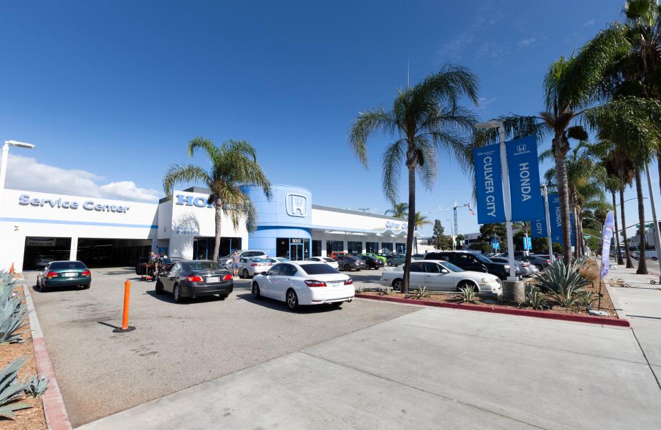This undated photo provided by Edmunds shows Culver City Honda dealership in Culver City, Calif. First-time buyers are likely to visit dealerships as they shop, but dealership service departments also can be sources of information on vehicle maintenance and repair costs. These are crucial elements in creating a realistic car-buying budget. (Scott Jacobs/Edmunds via AP)