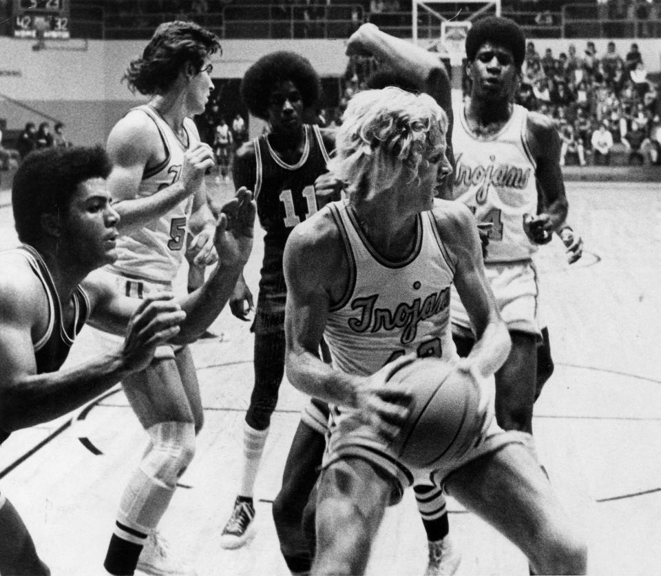 Mike Miday (with ball) is among the most prolific scorers to call the Field House home, averaging 23 points a game his senior year at Timken in 1975-76. He was first-team All-Ohio that season.