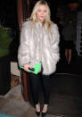 Celebrities in neon fashion: Laura Whitmore added a pop of colour to her outfit with a green clutch.<br><br>[Rex]