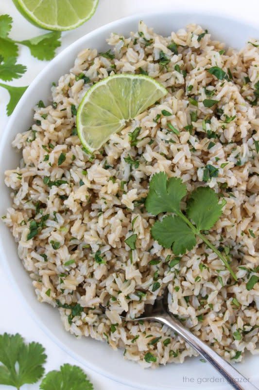 <p>The Garden Grazer</p><p>This cilantro lime brown rice is a perfect side dish for a wide variety of Mexican-inspired meals. Plus, it's simple to prepare!</p><p><strong>Get the recipe: <a href="https://www.thegardengrazer.com/cilantro-lime-rice/" rel="nofollow noopener" target="_blank" data-ylk="slk:Cilantro Lime Brown Rice;elm:context_link;itc:0;sec:content-canvas" class="link ">Cilantro Lime Brown Rice</a></strong></p>
