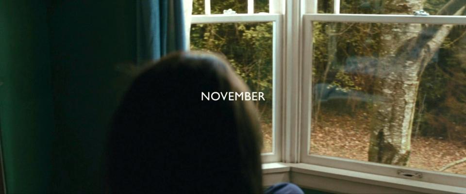 Kristen Stewart as Bella Swan, staring out a window, in "New Moon."