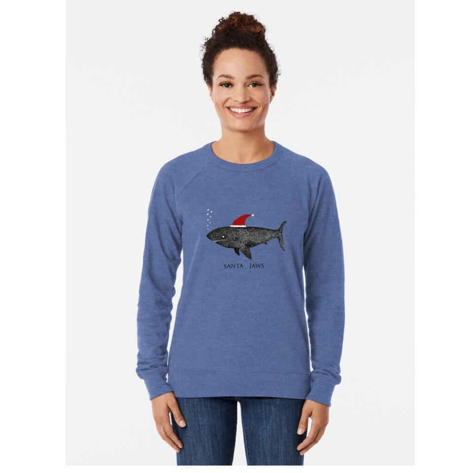 women wearing a Redbubble sweatshirt with a shark with a santa hat on it