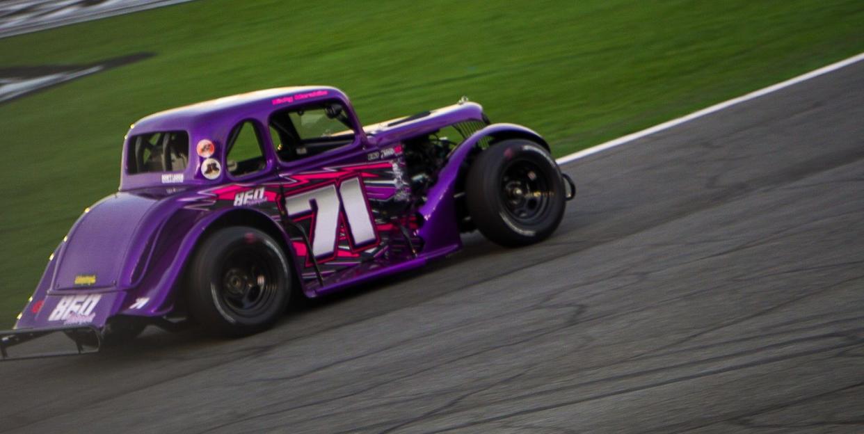 purple legends race car on track