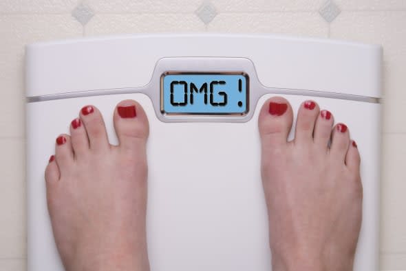 Digital Bathroom Scale Displaying OMG Message