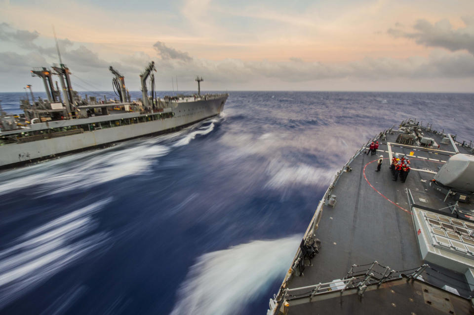 The Arleigh Burke-class guided-missile destroyer USS Fitzgerald (DDG 62), right, comes alongside the Military Sealift Command fleet replenishment oiler USNS Pecos (T-AO 197) for a replenishment-at-sea during Multi-Sail 2015 in waters near Guam. 