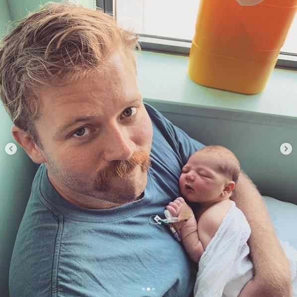 A photo of The Bachelor Australia 2015 contestant Jacinda Gugliemino's newborn son being held by her partner Callum Sauer.