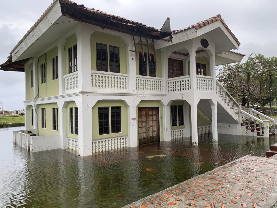 A building is flooded in Hagatna, Guam, Thursday, May 25, 2023, after Typhoon Mawar went through the area. (AP Photo/Grace Garces Bordallo)